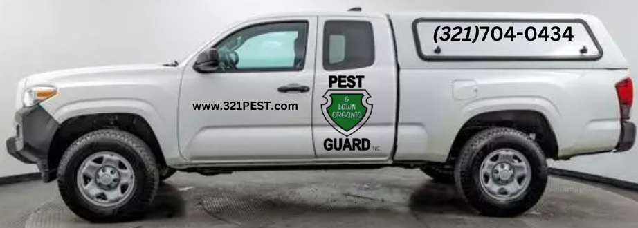 A white pickup truck with a pest control company logo, showcasing the company's professional appearance and commitment to service.