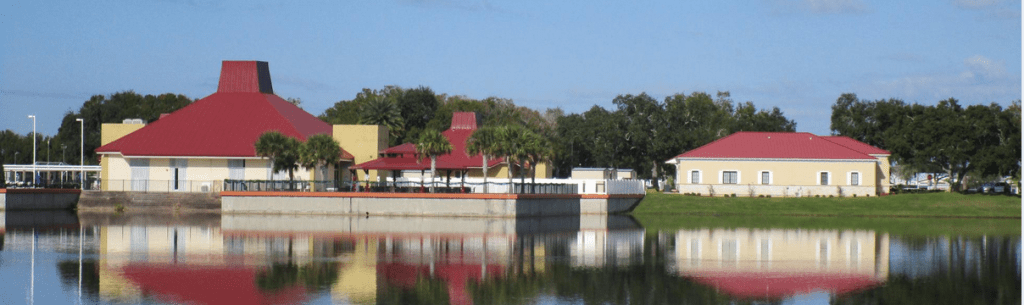 The Barefoot Bay Community Center reflected on the water. Barefoot Bay Termite Control Services