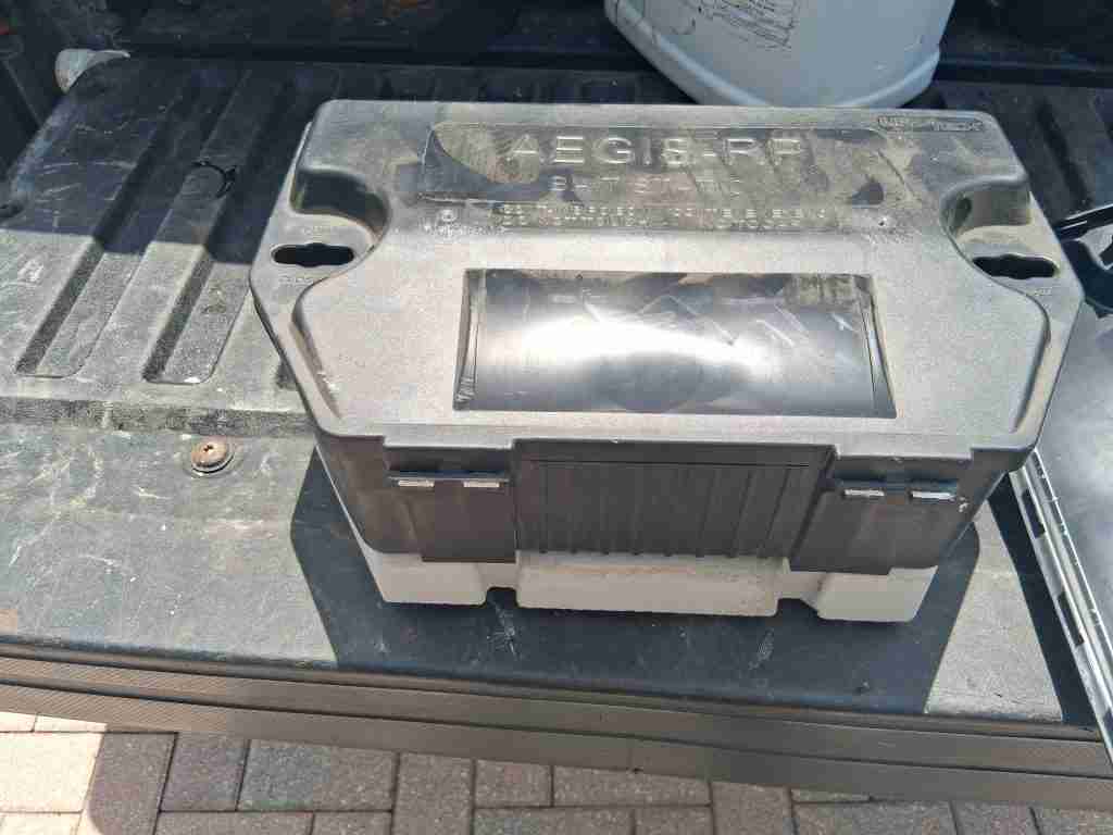 Closed black Aegis-RP rodent bait station.