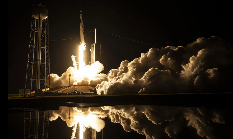 Night rocket launch from Kennedy Space Center on Merritt Island.