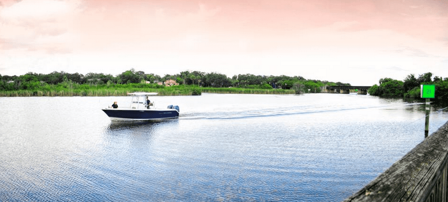 Tertmite Control Palm Bay, Boat moving along Turkey Creek near the Goode Boat Ramp in Palm Bay, Florida.