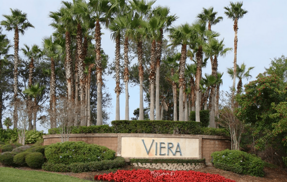 Viera sign with palm trees and landscaping