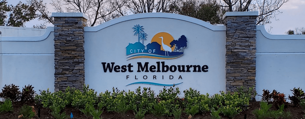 Termite Control West Melbourne, The City of West Melbourne sign at dusk.
