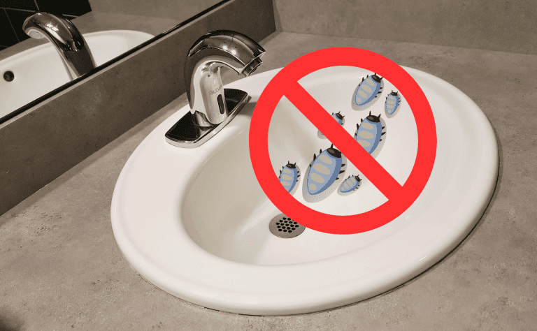 Bathroom sink drain with a red circle/slash over several cartoon cockroaches, indicating prevention.